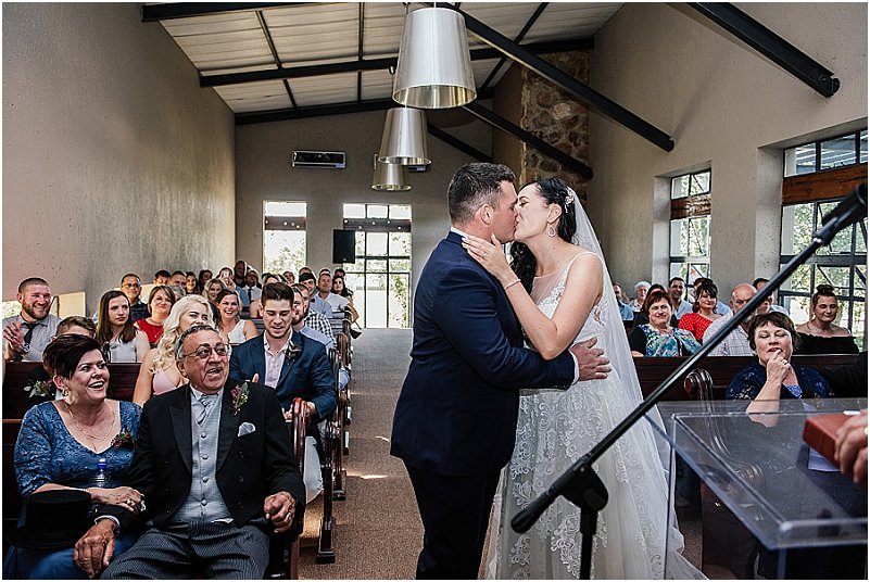 groom kissing bride