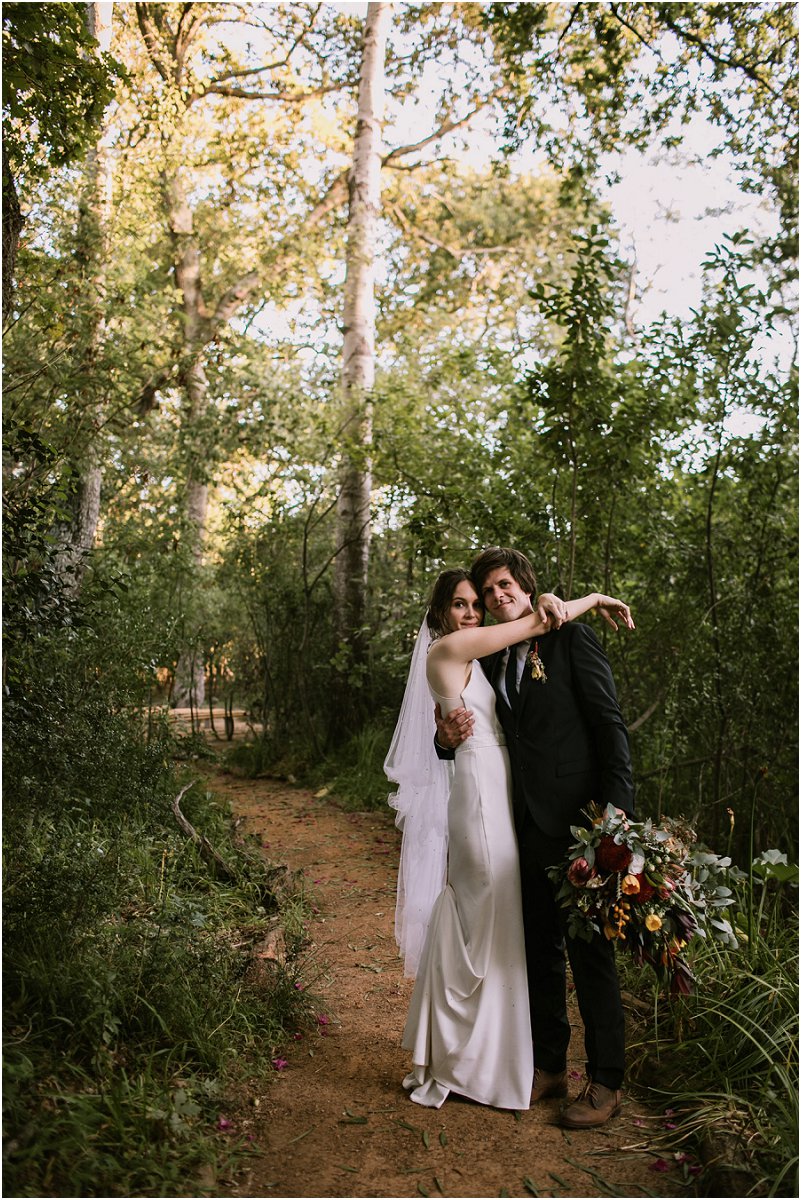 Bridal couple under trees