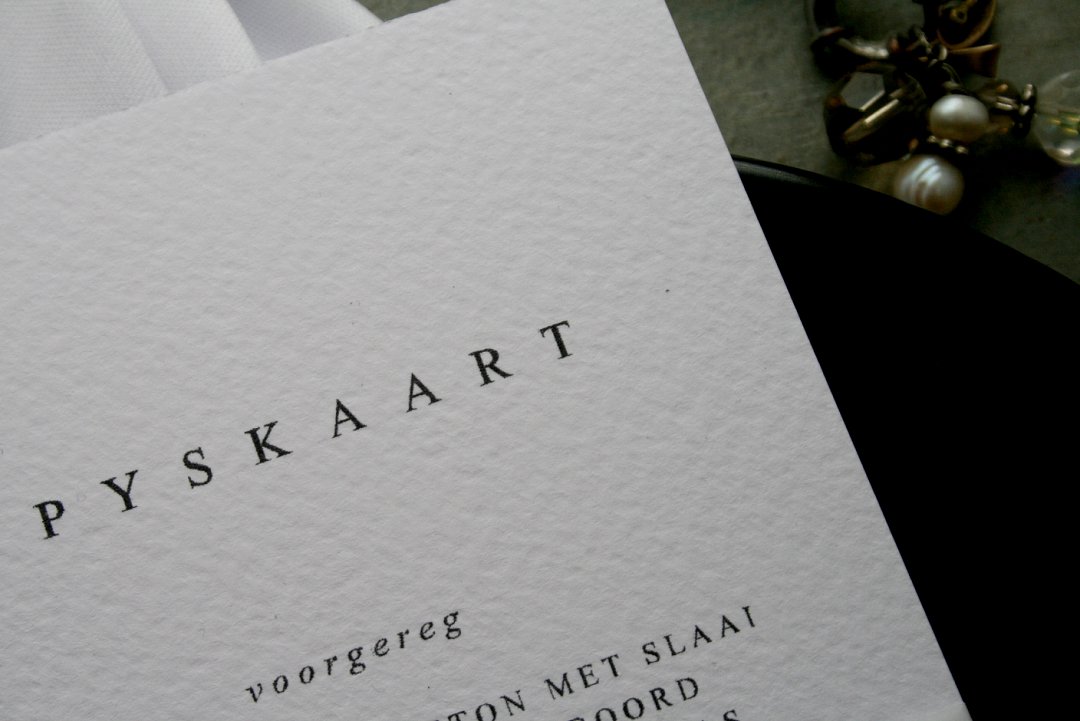 Texture white, black and gold wedding menu