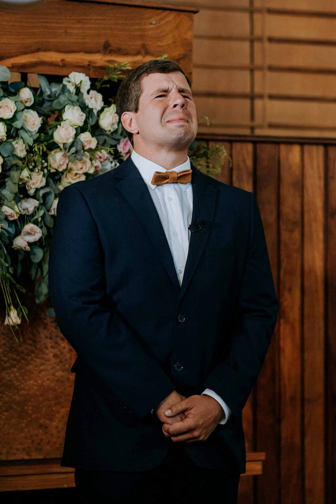 emotional groom at altar